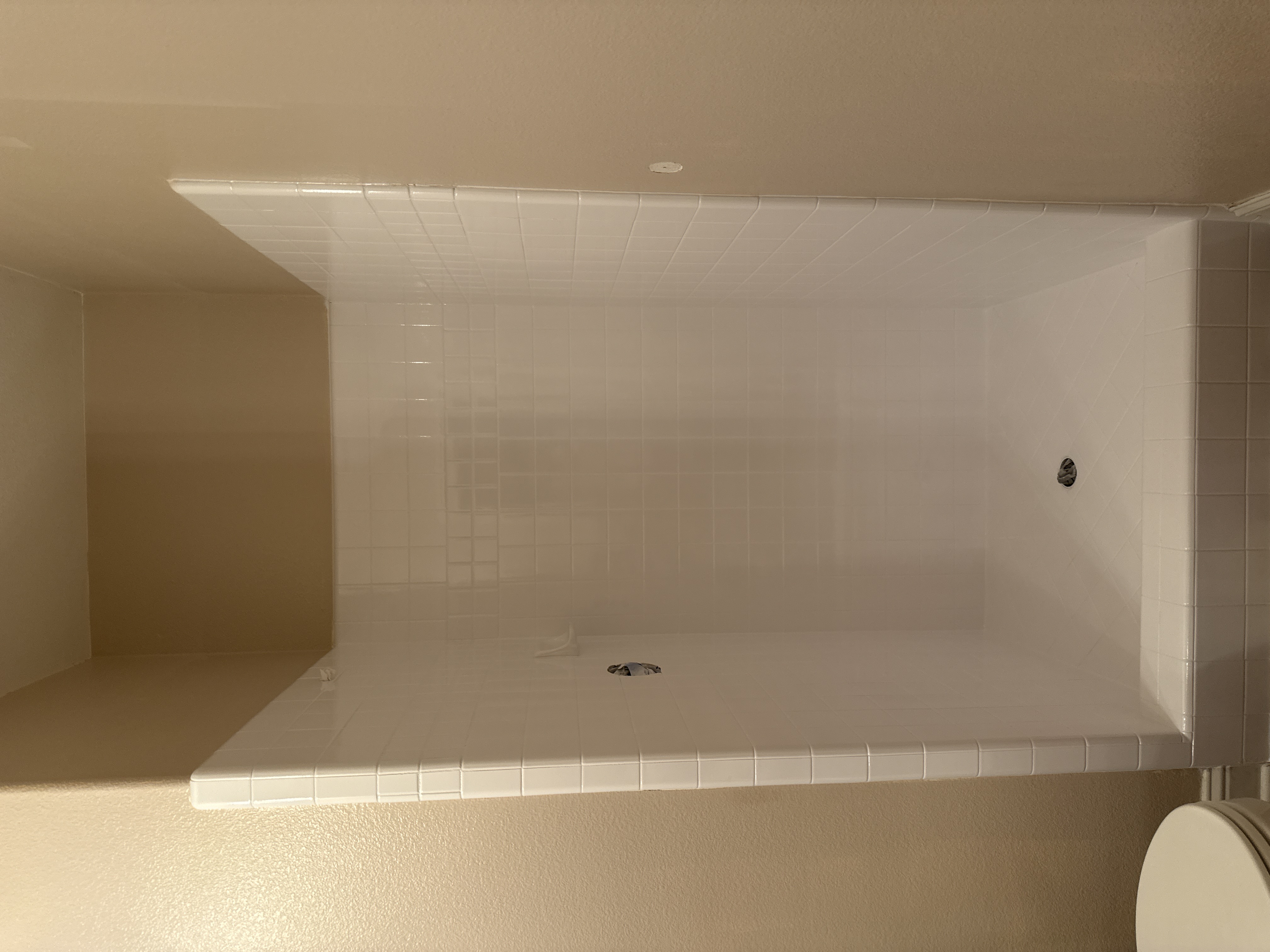 Bright white shower tile after professional reglazing - Bay Area tile refinishing results