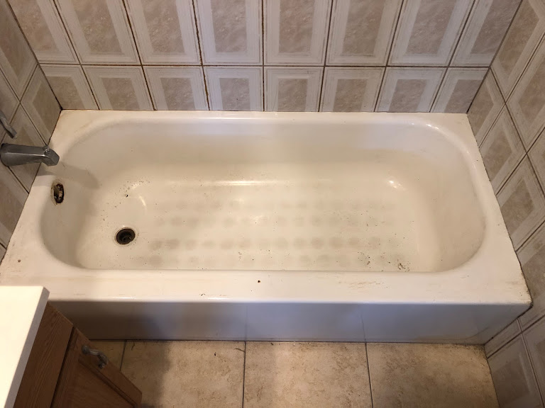 Rusted cast iron tub before refinishing