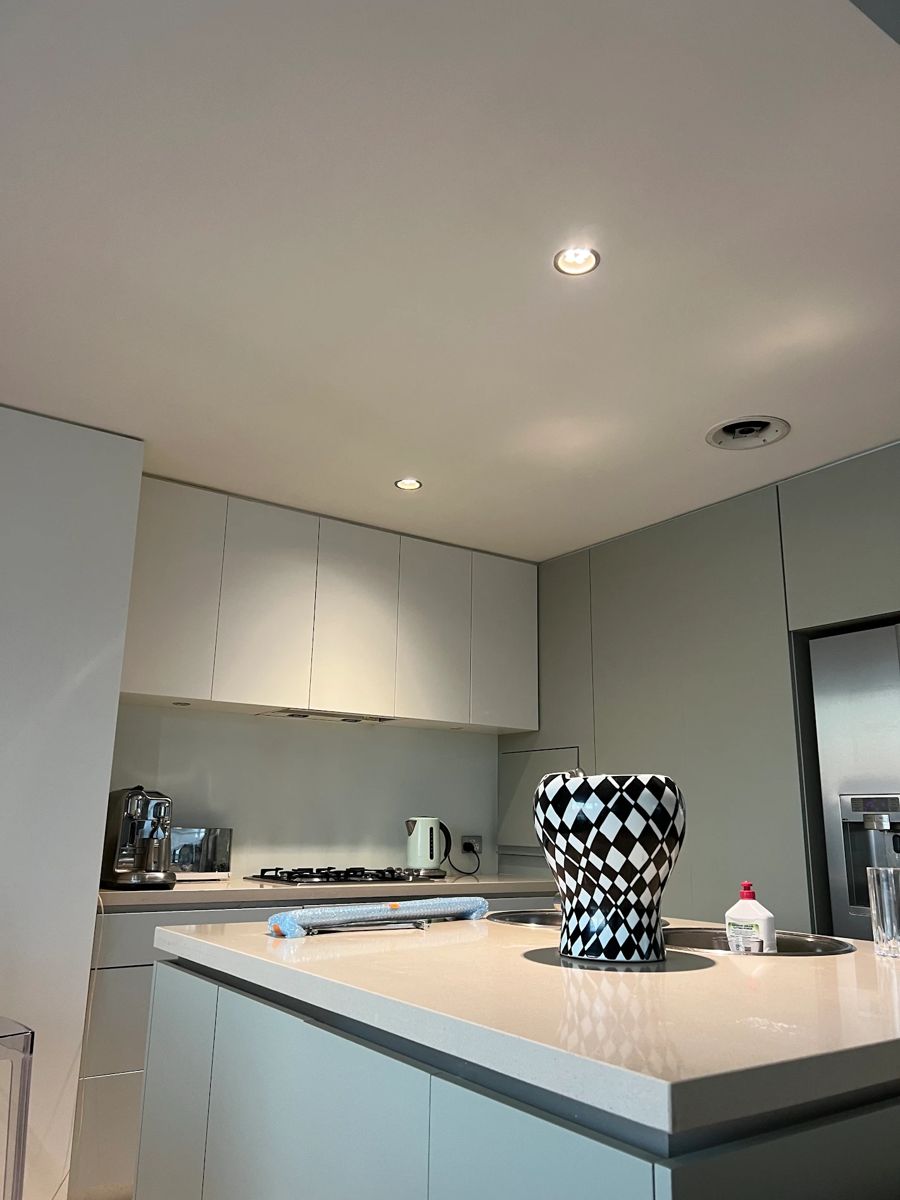 Kitchen with cabinets sprayed sage green and white